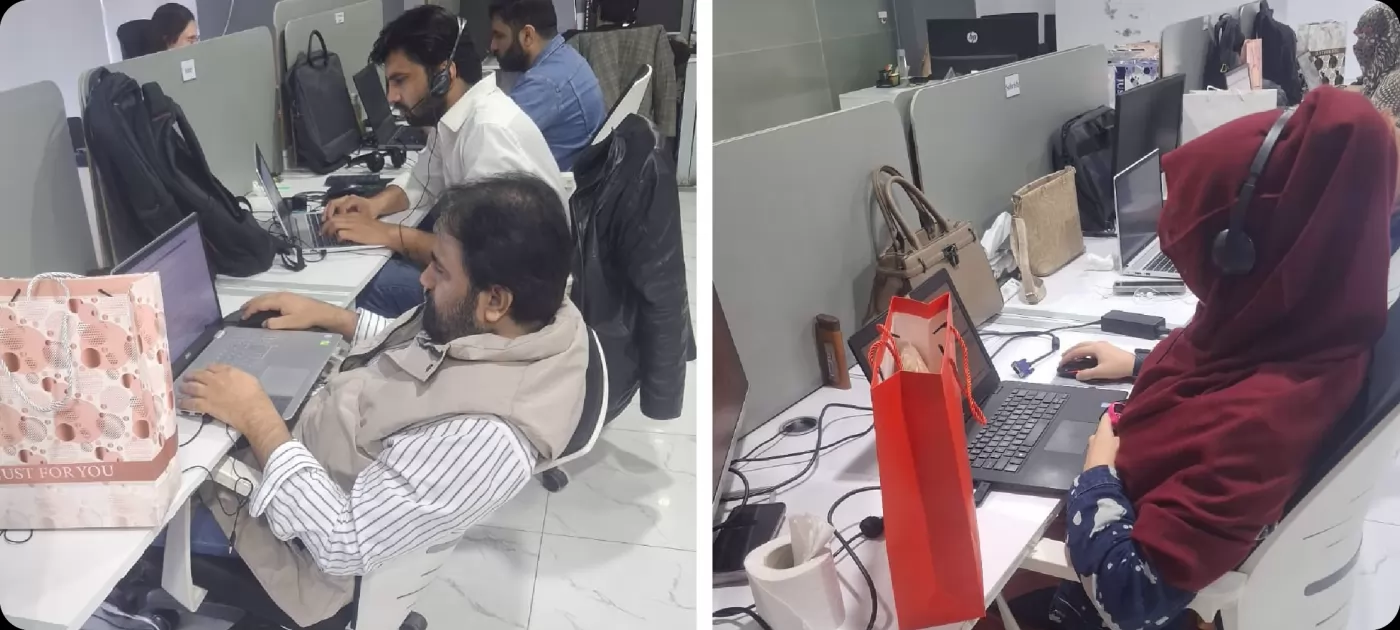 Team members working at their desks in the Lahore office