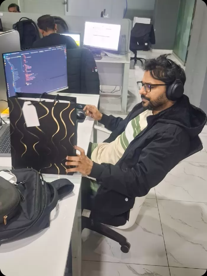 A developer at work on a two-screen setup