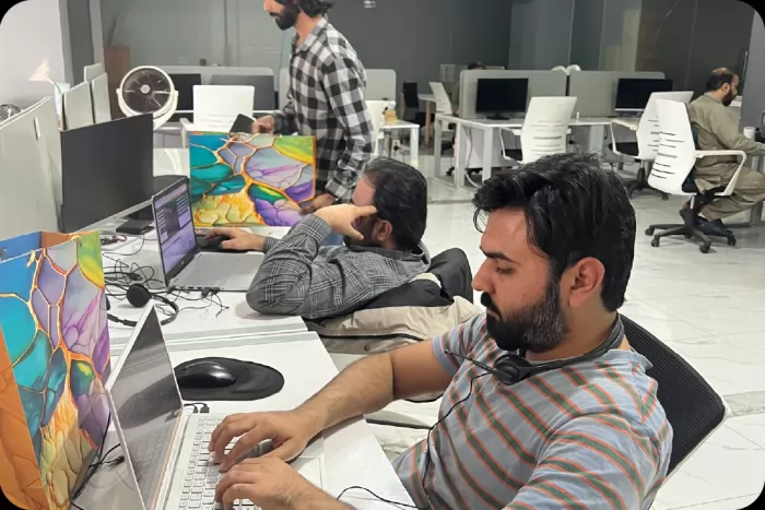 The open-plan office floor during the working day