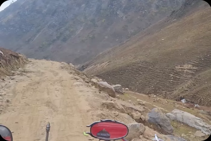 A rough track cut into a mountainside