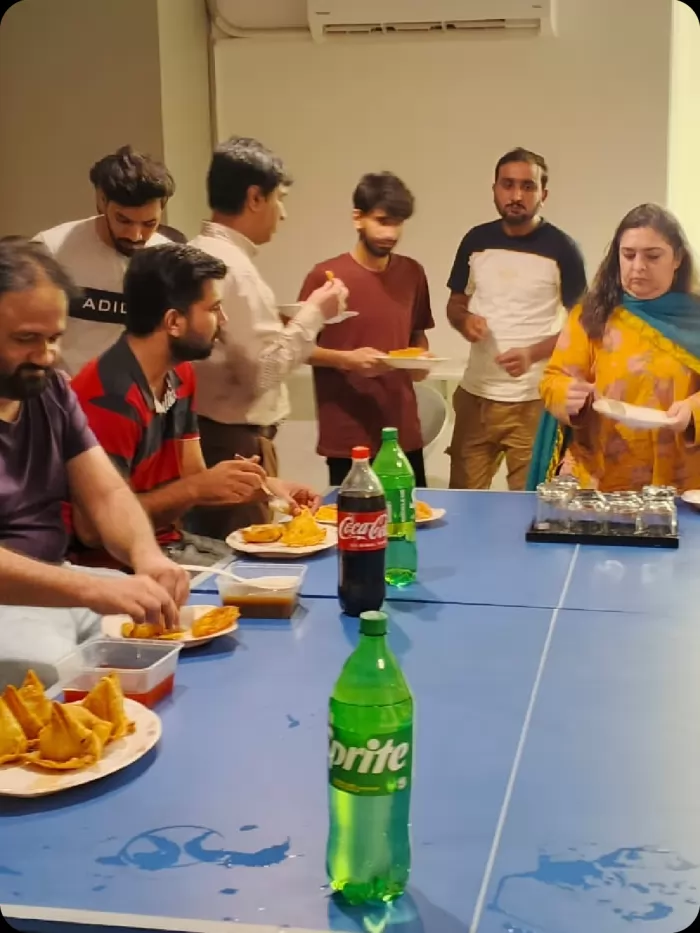 The team serving food around the office table