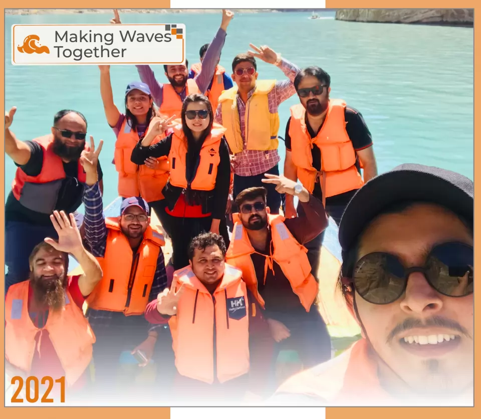 2021 — Making Waves Together: the team in life jackets on a boat trip.