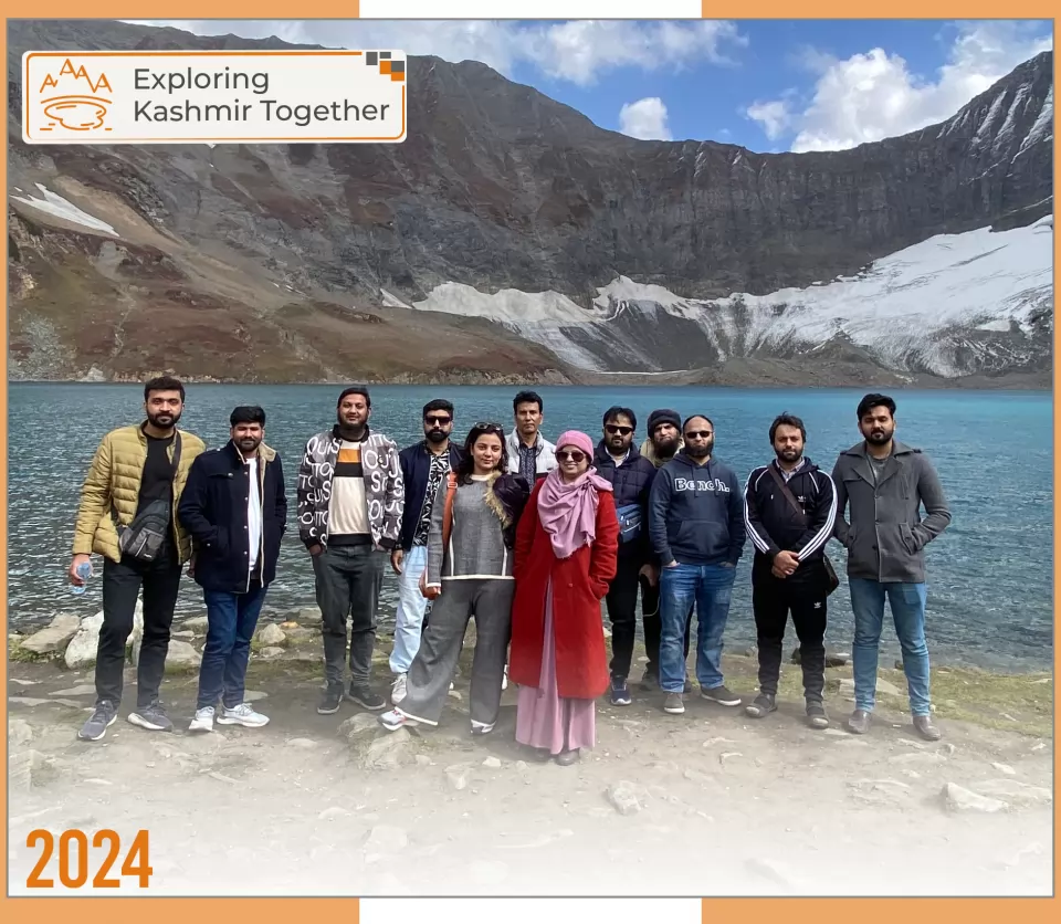 2024 — Exploring Kashmir Together: the whole team beside a lake in Kashmir.